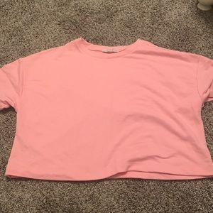I’m selling one pink shirt never worn it’s just plain with no writing.